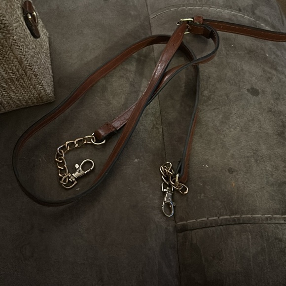 A purse that’s tan and brown with gold accents - Picture 3 of 5